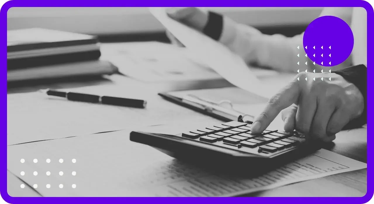 A financial professional using a calculator representing edgefi's managed IT and security services for financial services companies