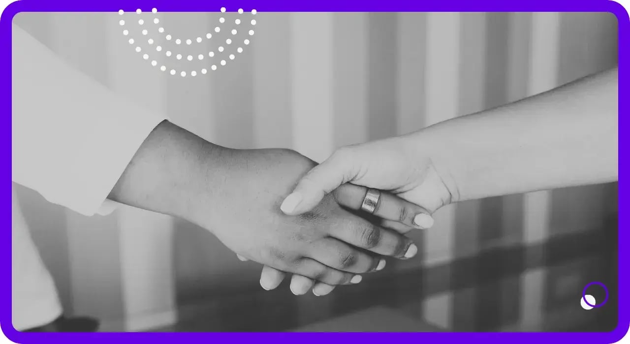 A professional handshake representing our partnership approach to IT and security services