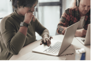 Employee on laptop during offboarding process