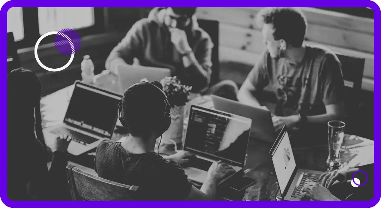 A business team collaborating with technology supported by expert IT and security services